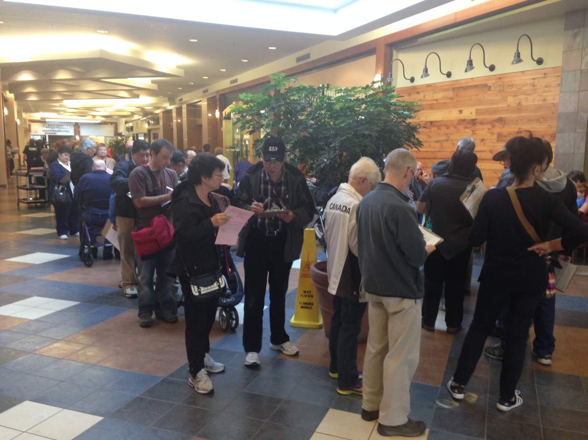 People lined up inside Brentwood Mall for a flu shot