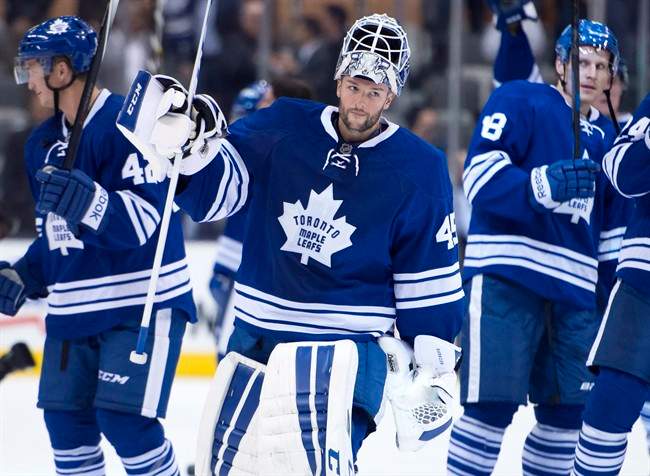 Toronto Maple Leafs goaltender Jonathan Bernier salutes the crowd after a 4-0 win over the Buffalo Sabres in NHL action in Toronto on Tuesday October 28, 2014. THE CANADIAN PRESS/Frank Gunn.