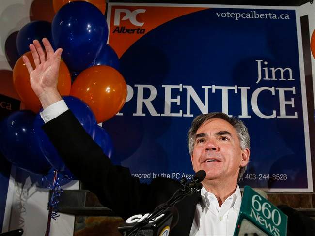 Alberta Premier Jim Prentice celebrates after winning a seat in the provincial legislature following a byelection in Calgary, Monday, Oct. 27, 2014. 
