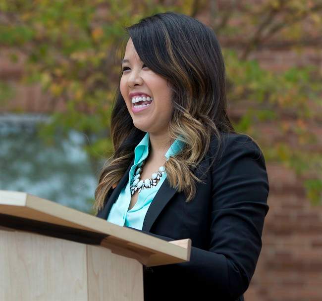 Nina Pham smiles as she speaks outside of National Institutes of Health (NIH) in Bethesda, Md., Friday, Oct. 24, 2014.