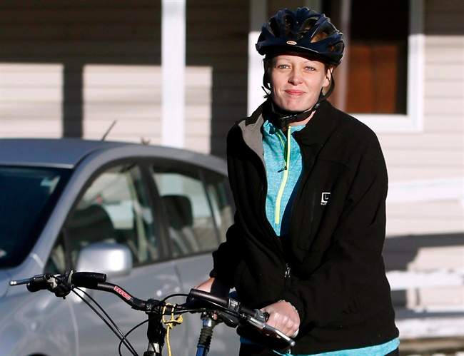 Nurse Kaci Hickox leaves her home on a rural road in Fort Kent, Maine, to take a bike ride with her boyfriend Ted Wilbur, Thursday, Oct. 30, 2014.