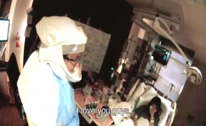 In this frame grab taken from video provided by Texas Health Resources, Nina Pham, right, who contracted Ebola after treating a Liberian man, wipes her face as she talks to her coworkers at Texas Health Presbyterian Hospital in Dallas, Thursday, Oct. 16, 2014, before being flown to the National Institutes of Health outside Washington.