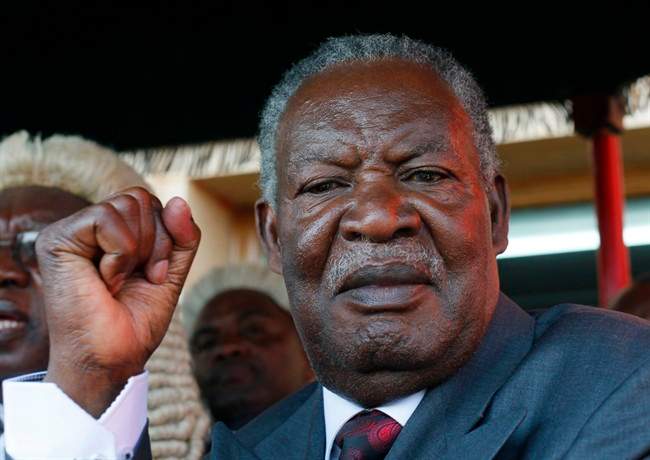 In this Sept. 23, 2011 file photo, Zambian president Michael Sata waves after taking the oath of office on the steps of the top court in Lusaka, Zambia.