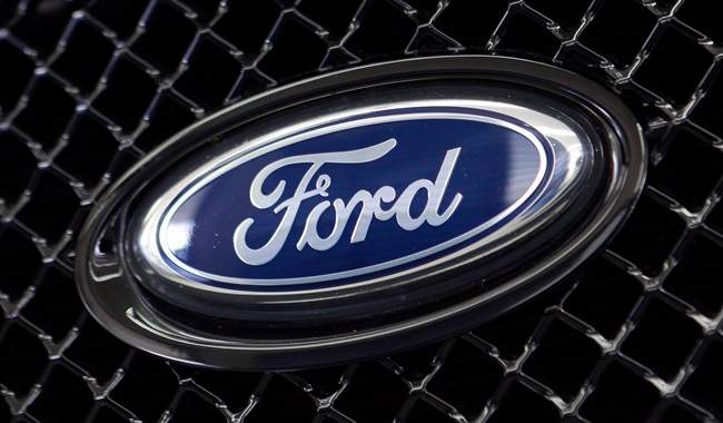 This photo taken Thursday, Aug. 21, 2014 shows the Ford logo on a vehicle at a dealership in Hialeah, Fla. 