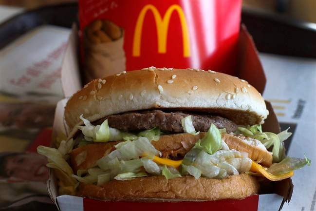 FILE - This Tuesday, Jan. 21, 2014, file photo showsa McDonald's Big Mac sandwich at a McDonald's restaurant in Robinson Township, Pa. The world’s biggest hamburger chain is confronting unappetizing questions as part of a U.S. campaign to beat back perceptions that it serves Frankenfood. The company has run similar campaigns in Canada and Australia and said Monday, Oct. 13, 2014, it’s bringing the effort to its flagship market. (AP Photo/Gene J. Puskar, File)
