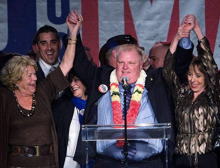 Toronto Mayor-elect Rob Ford raises his arms with his wife Renata, right, and mother Diane, left, as he speaks to supporters in Toronto on Monday, October 25, 2010.