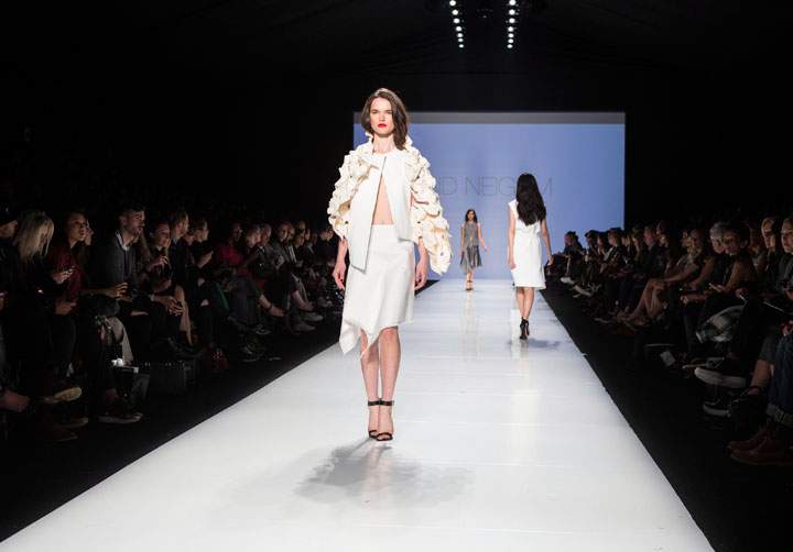 A model takes to the runway while showing a creation by Sid Neigum, the winner of the Mercedes-Benz Start Up show, during Toronto Fashion Week in Toronto on Monday, October 20, 2014.