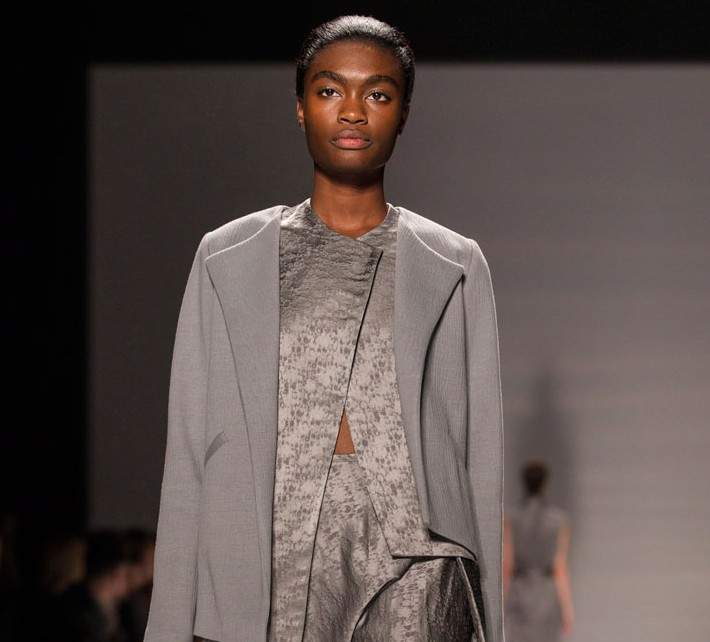 A model shows a creation from Sid Neigum while walking the runway during Toronto Fashion Week in Toronto on Monday, October 20, 2014.