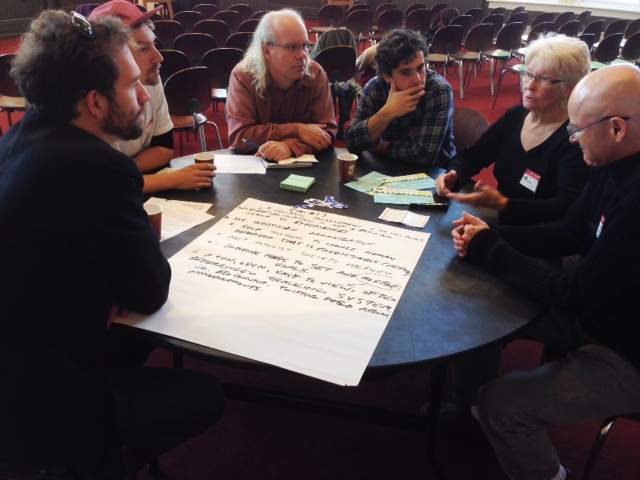 Citizens of Winnipeg gather to review the Winnipeg's Great Transition document Saturday.