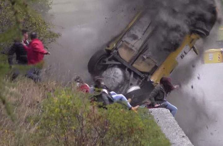 A spectator narrowly escapes being hit by a vehicle as it flips over at the Jolly Rally Valle d’Aosta 2014 in northern Italy.