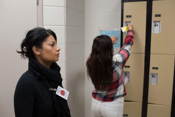 At the visitor’s entrance to the Central East Correctional Centre, in Lindsay, ON, Pam and Melika stash personal possessions, mobile phones and other items prohibited from being taken inside the prison in a locker. Their weekly visit with Masoud lasts 20 minutes.