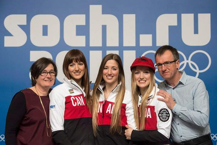 Women's moguls Olympic gold medalist Justine Dufour-Lapointe, second from right, poses with her sister and silver medalist Chloe, centre, and her other sister Maxime and mother Johane Dufour and father Yves Lapointe at the Sochi Winter Olympics in Sochi on Sunday, February 9, 2014.