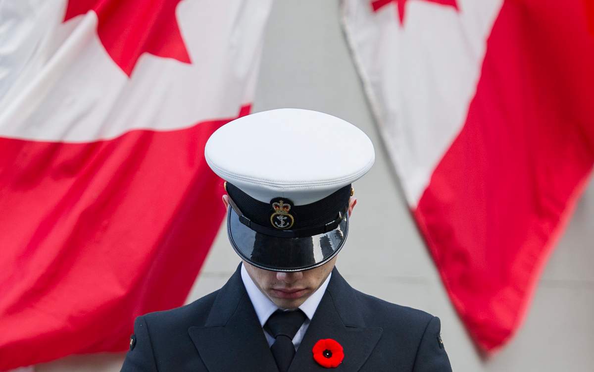 A member of the Canadian forces stands to attention during Remembrance Day ceremonies in Montreal, Tuesday, November 11, 2014. 