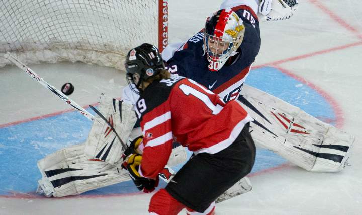 Canada's Brianne Jenner scores the game-winning goal past United States goaltender Molly Schaus during the shootout in the gold medal game of the Four Nations Cup women's hockey tournament in Kamloops, B.C. Saturday, Nov. 8, 2014. 