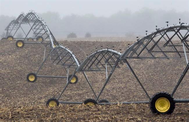 FILE - In this April 19, 2012 file photo, an irrigation pivot remains still along highway 14, several miles near the proposed new route for the Keystone XL pipeline in Neligh, Neb.