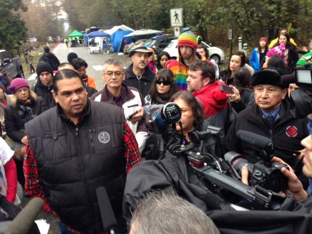 Grand Chief Stewart Phillip (far right) addresses the crowd before his arrest.