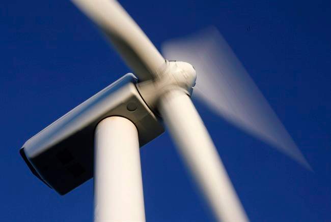 Blades rotate on a wind turbine on Stetson Mountain in Range 8, Township 3, Maine in July, 2009. 