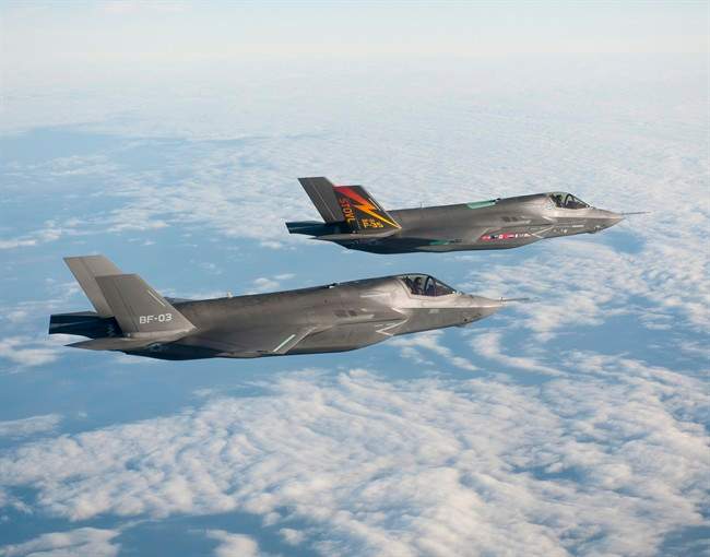 Two Lockheed Martin F-35B aircraft fly in formation on Nov. 10, 2010 at Naval Air Station Patuxent River, Md.