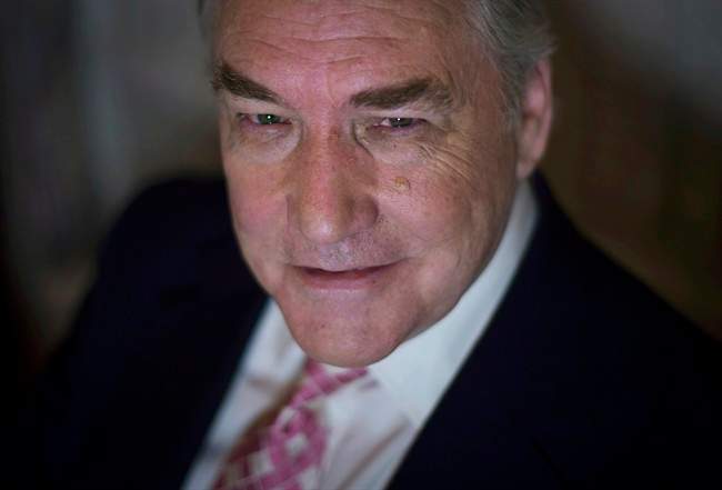 Conrad Black poses at the University Club in Toronto on Tuesday, November 11, 2014. 