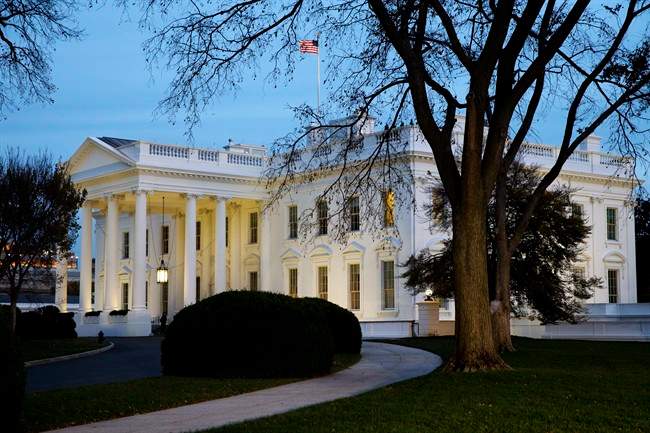 The White House is seen at dusk in Washington, Wednesday, Nov. 19, 2014.