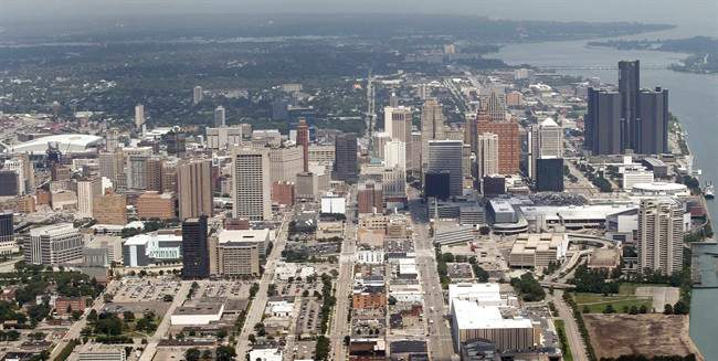 FILE - This July 17, 2013 aerial photo shows the city of Detroit. On Friday, Nov. 7, 2014, federal bankruptcy judge Steven Rhodes is expected to decide whether Detroit's plan to exit bankruptcy is fair and feasible. (AP Photo/Paul Sancya, File).