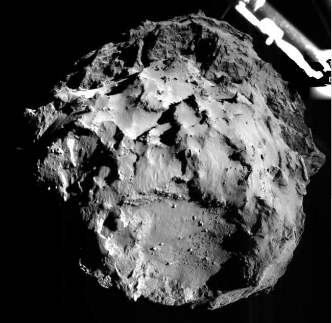 The picture released by the European Space Agency ESA on Wednesday, Nov. 12, 2014 was taken by the ROLIS instrument on Rosetta's Philae lander during descent from a distance of approximately 3 km from the 4-kilometer-wide (2.5-mile-wide) 67P/Churyumov-Gerasimenko comet. Hundreds of millions of miles from Earth, the European spacecraft made history Wednesday by successfully landing on the icy, dusty surface of a speeding comet. 