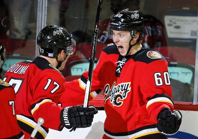 File photo of Calgary Flames' Markus Granlund, right, and Lance Bouma, left, from Nov. 15, 2014.