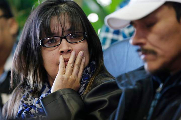 Julie and Caesar Harper, parents of Rinelle Harper, listen as Grand Chief David Harper speaks at a press conference in Winnipeg on Thursday.