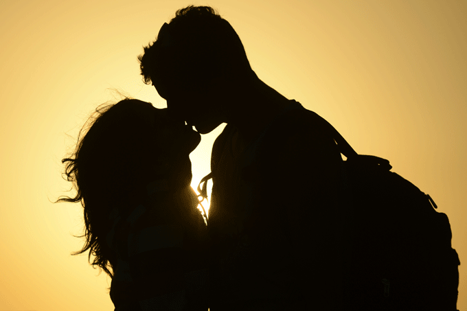 A couple kiss near the shore of El Yaque Beach, Nueva Esparta state, Margarita Island, Venezuela on January 31, 2014. 