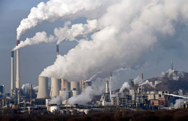 FILE - In this Wednesday, Dec. 16, 2009 file photo, steam and smoke rises from a coal burning power plant in Gelsenkirchen, Germany. 