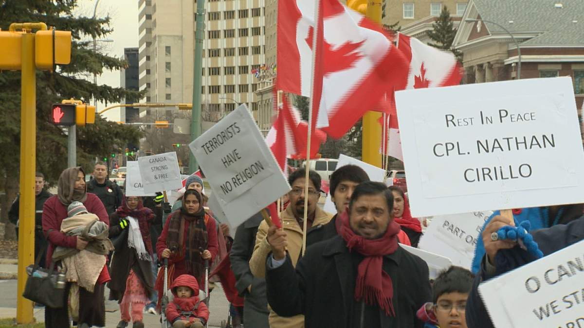 Members of Regina's Muslim community marched on sidewalks downtown on Saturday.