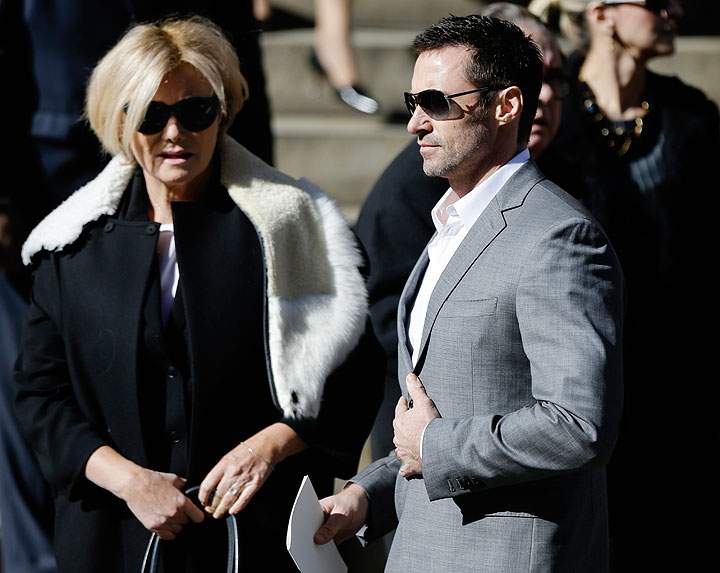 Hugh Jackman, right, leaves the Church of St. Ignatius Loyola on Manhattan’s Upper East Side after a private funeral for Oscar De la Renta, Monday, Nov. 3, 2014, in New York.