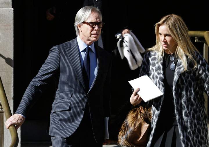Tommy Hilfiger, left, leaves the Church of St. Ignatius Loyola on Manhattan’s Upper East Side after a private funeral for Oscar De la Renta, Monday, Nov. 3, 2014, in New York.