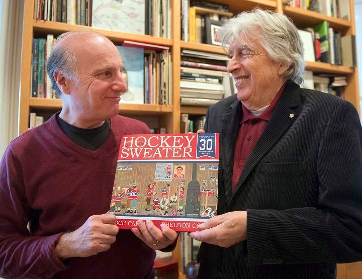 Roch Carrier, right, author of the book “The Hockey Sweater,” and illustrator Sheldon Cohen pose for photos Wednesday, November 19, 2014 in Montreal. The iconic Canadian children’s book is marking its 30th anniversary.