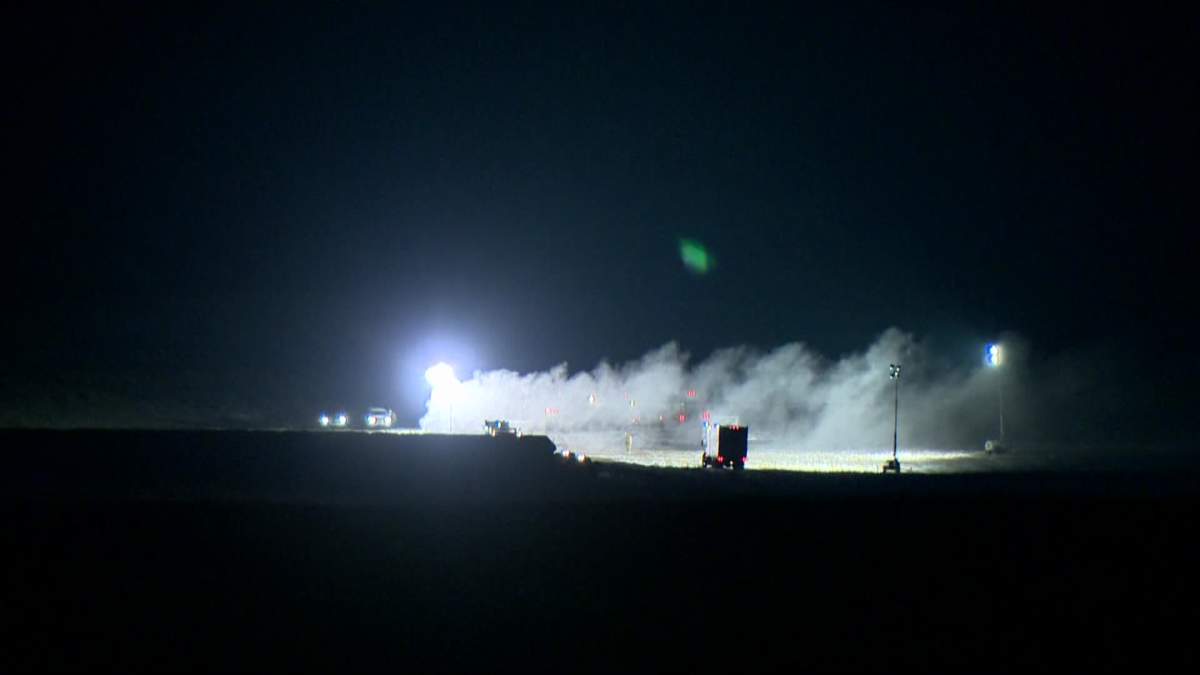 Crews work to cap sour gas well southwest of Airdrie.