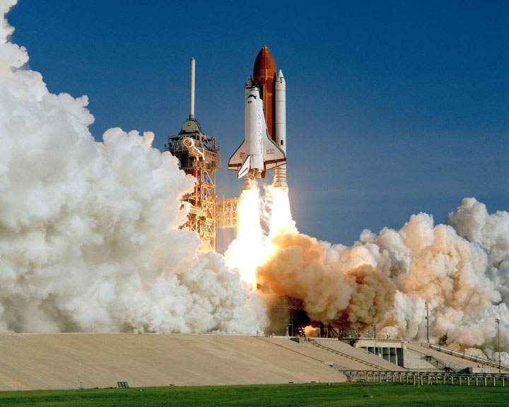 The space shuttle Discovery lifts off on its maiden voyage. Numerous companies were involved in its development and construction.
