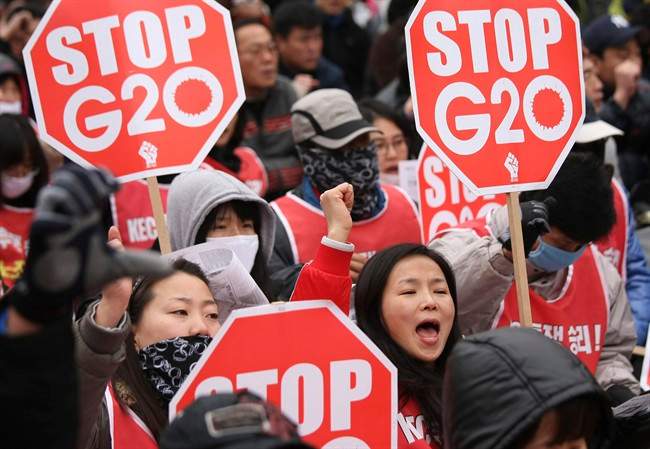 FILE - In this Thursday, Nov. 11, 2010 file photo, protesters gather to denounce the G-20 Summit. Since 2010, the G-20 has issued two-year action plans on anti-corruption efforts, and a report on what has been achieved under the last plan is expected at this weekend's summit. The leaders will also issue a new plan for 2015-16, which is expected to include commitments on issues such as foreign bribery, stolen asset recovery and whistleblower protection, said A.J. Brown, a director with Transparency International Australia. (AP Photo/Wally Santana, File).