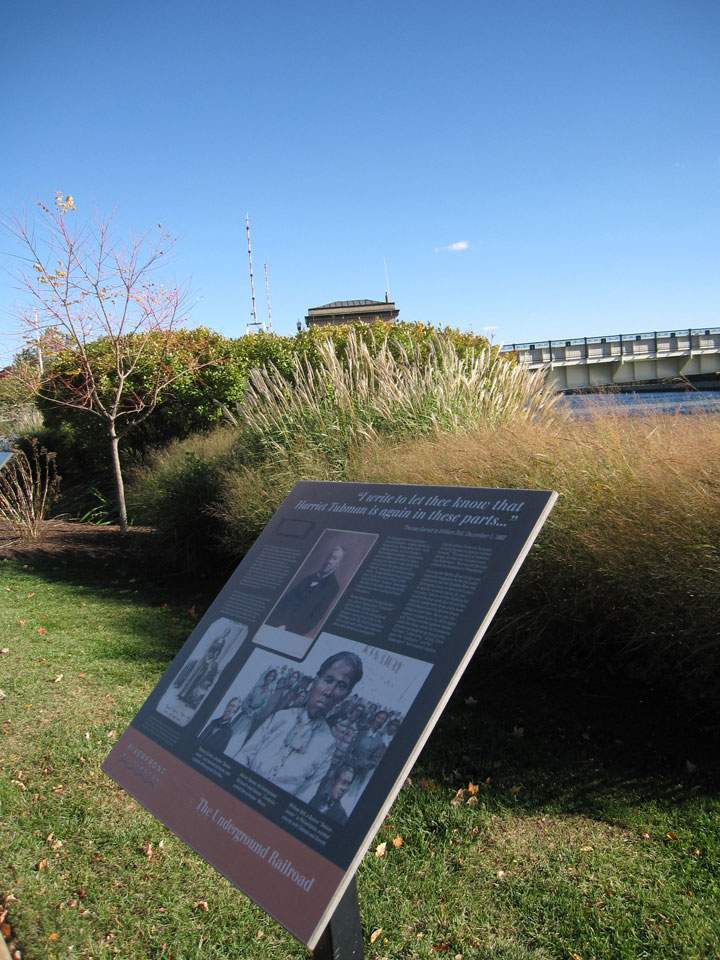 This Oct. 26, 2014 photo shows a marker on the waterfront in Wilmington, Del., honoring the efforts of Underground Railroad leader Harriet Tubman and Thomas Garrett, a Wilmington businessman whose home was a waystation for individuals fleeing slavery. A riverfront park is named for both of them, and the marker is one of many around the city offering insight into local African-American history.