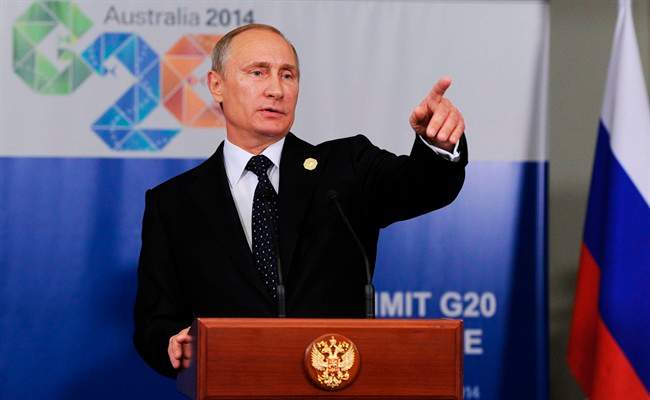 In this photo taken on Saturday, Nov. 15, 2014, Russian President Vladimir Putin speaks to the media before departing from the G-20 summit in Brisbane, Australia. 