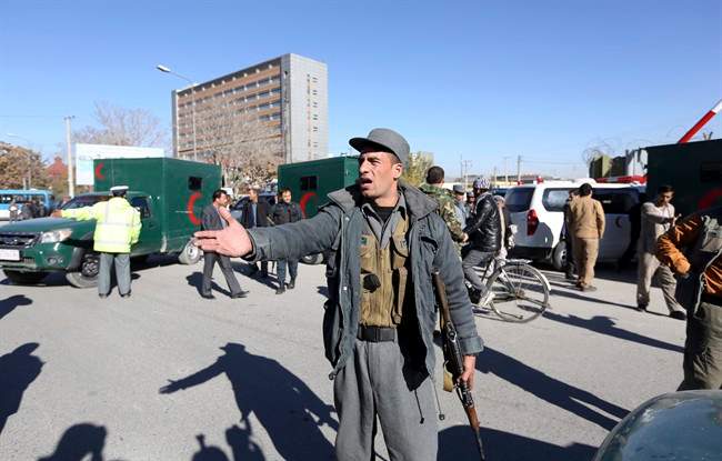 Afghan police inspect the site of a suicide attack in Kabul, Afghanistan, Sunday, Nov. 9, 2014. 