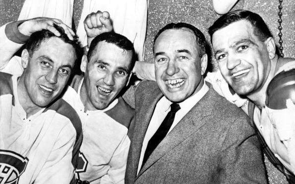 Jean Béliveau, #4, Jacques Plante, #1, head coach Toe Blake and Bernie Geoffrion, #5, of the Montreal Canadiens celebrate their last victory of the season against the Detroit Red Wings on March 19, 1961 at the Detroit Olympia Stadium in Detroit, Michigan.