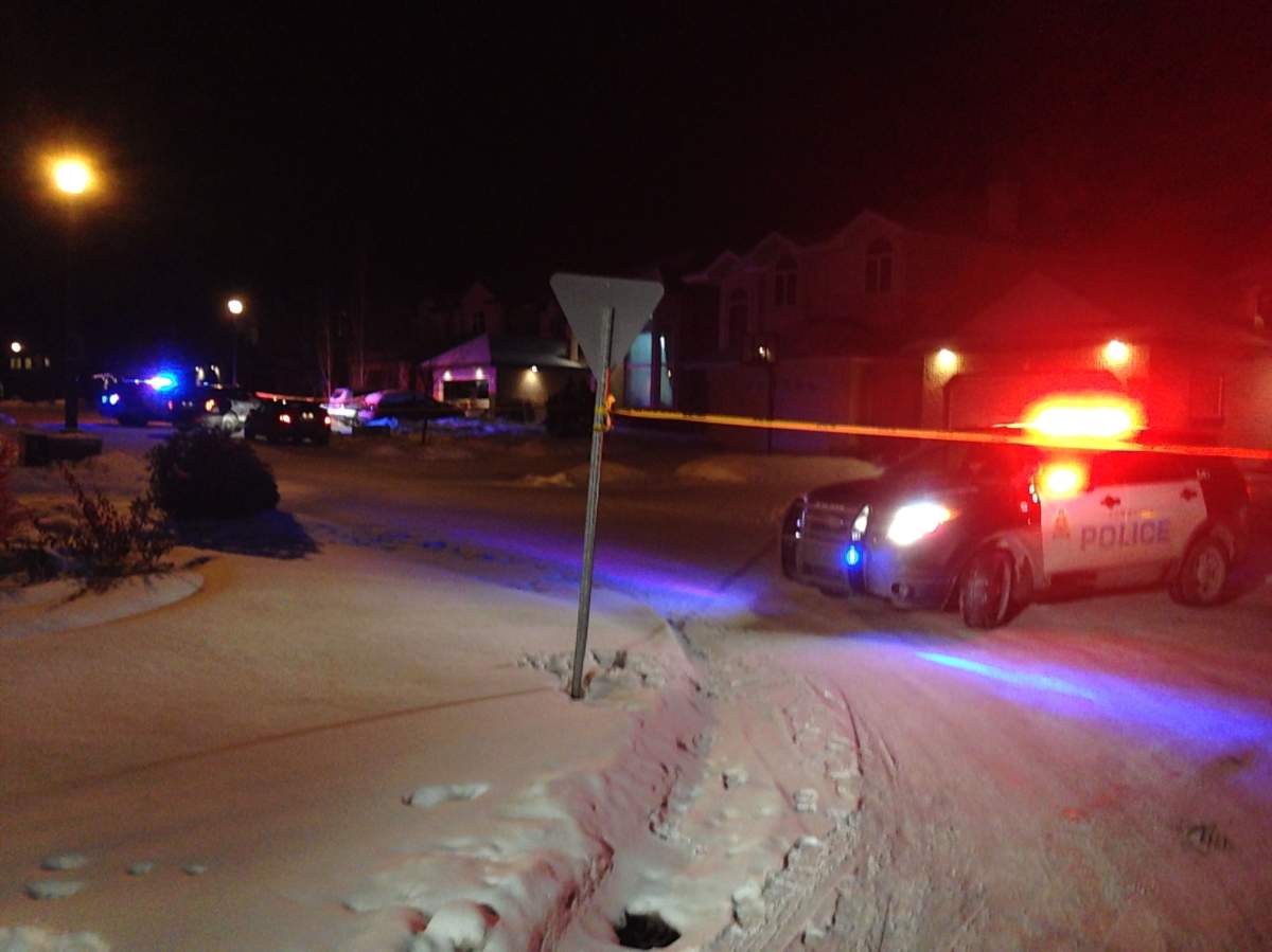 Police investigate a homicide near Haswell Court and 16 Avenue on Dec. 29, 2014.