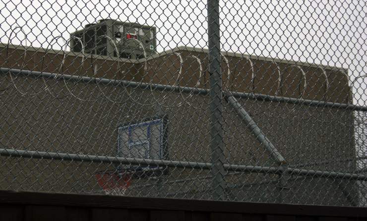 A razor wire fence is seen at the Canada Border Services Agency immigration detention facility on Rexdale Blvd., near Toronto's Person International Airport. 