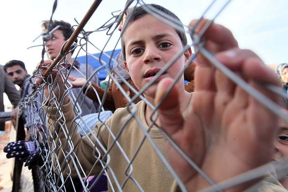 Syrian refugees fled their homes due to the civil war in their country try to hold on life under tough living conditions at Babel refugee camp in eastern Lebanese city of Arsal on December 05, 2014. Syrian refugees in Lebanon face starvation after the suspension of United Nations World Food Programme (WFP) food voucher aid for more than 1.7 million Syrian refugees since financial commitments from nations and other donors remain unfulfilled causing shortfall in funds needed to support refugees in December. 