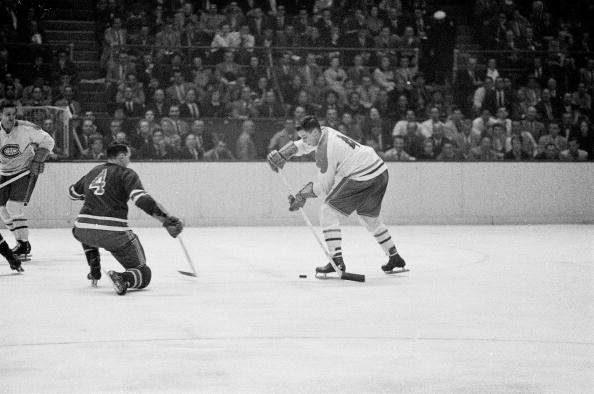 Montreal Canadiens Jean Béliveau (4) in action vs New York Rangers Bill Gadsby (4) at the Madison Square Garden in New York, NY 10/24/1956.