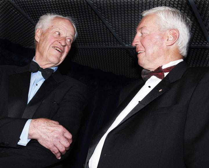 Hockey great Gordie Howe (left) shows Jean Beliveau his elbow (he was famous for elbowing) prior to a charity dinner at the Bell Centre in honour of Beliveau, the former Montreal Canadiens hockey great, in Montreal on March 29, 2007.