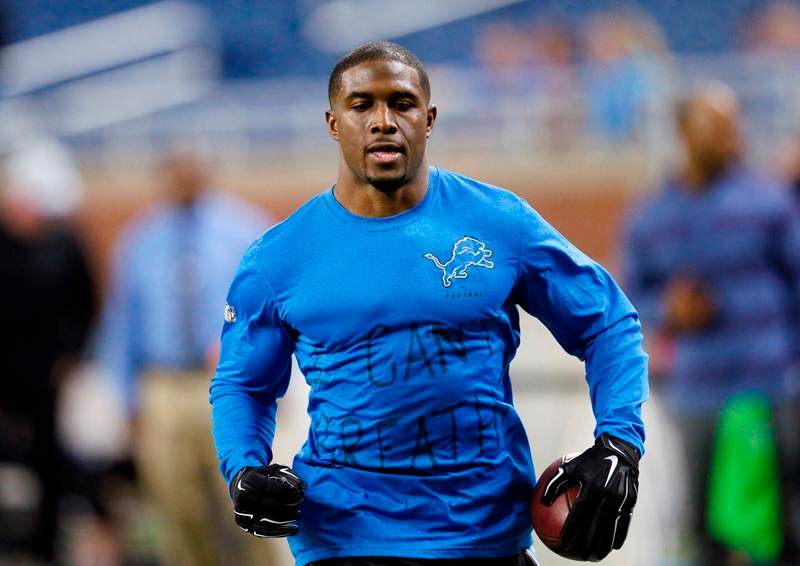 Wearing a Detroit Lions shirt with "I can't breathe" written on the front, running back Reggie Bush runs through pre-game warmups in an NFL football game against the Tampa Bay Buccaneers in Detroit, Sunday, Dec. 7, 2014. 