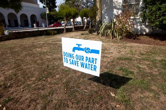 In this July 29, 2014 file photo, a water conservation sign is displayed outside of City Hall in Santa Cruz, Calif.