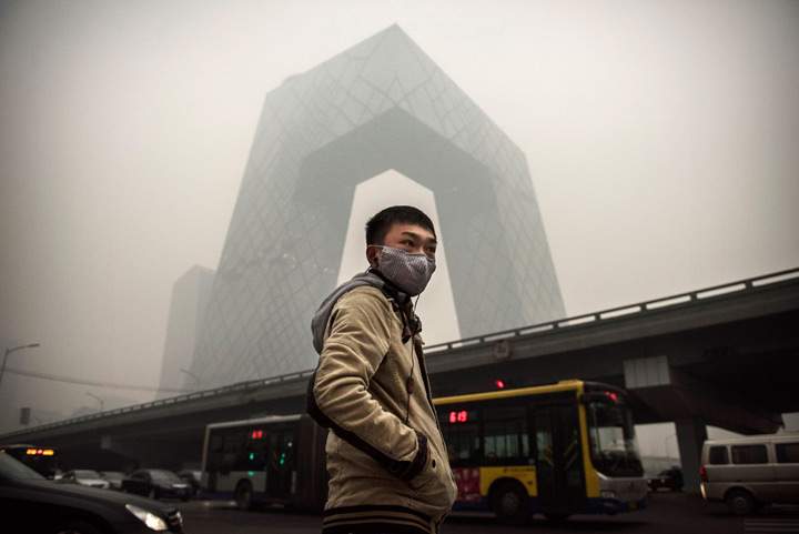 A Chinese man wears a mask in Beijing.