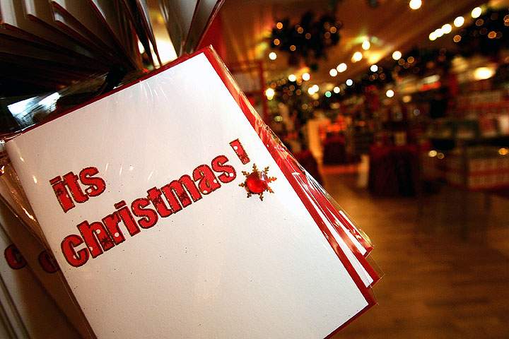 With the ability to send festive greetings electronically, what is the enduring appeal of putting traditional cards in the post?